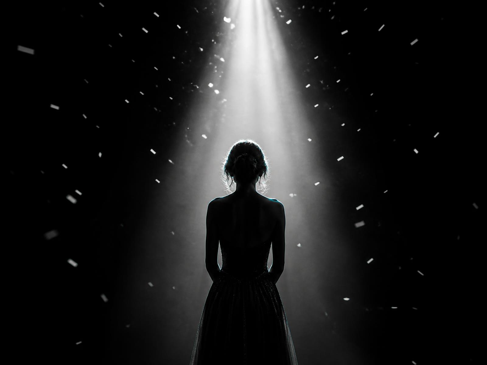 Planner standing in a spotlight